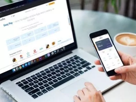 How can a foreigner pay utility bills for an apartment in Ukraine?